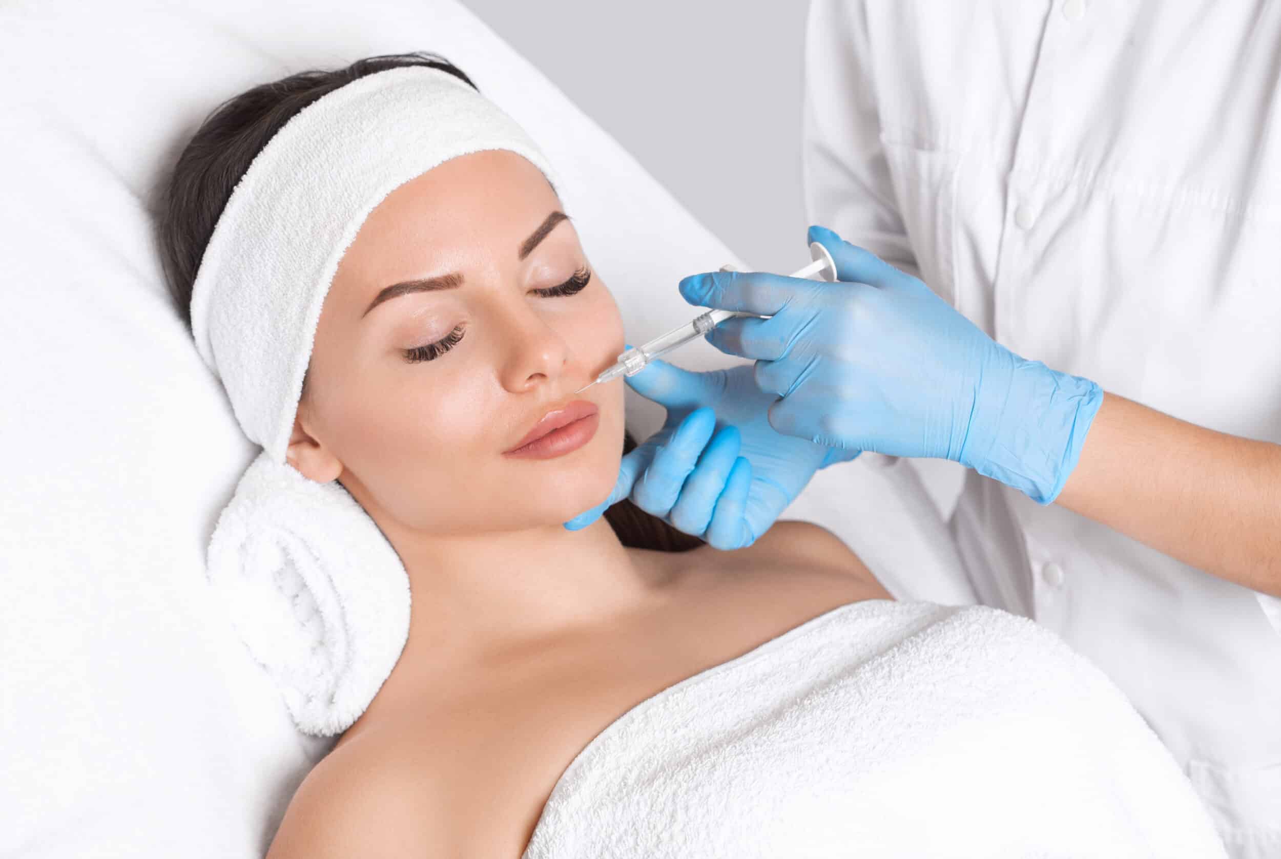 Woman closes her eyes, looking relaxed and peaceful during her PRP treatment