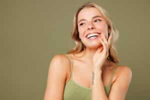 Young woman with luminous skin after a facial and face waxing